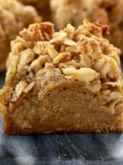 Close-up of gluten-free pumpkin pie bars with nut topping.
