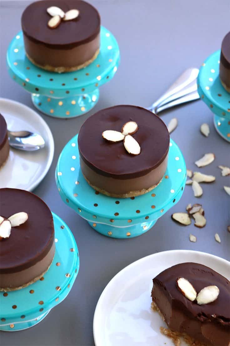 Elegant gluten-free vegan mini chocolate cream cakes decorated with slivered almonds