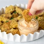 Gluten Free Chicken Nuggets dipped into spicy mayo