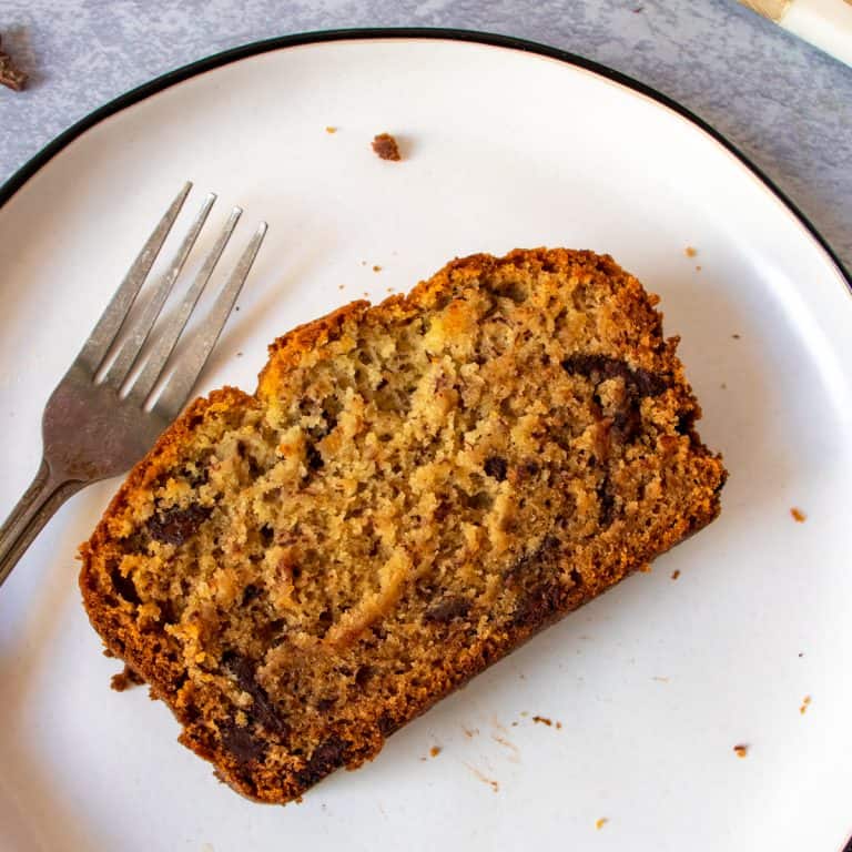 Gluten Free Chocolate Chip Banana Bread slice on white plate