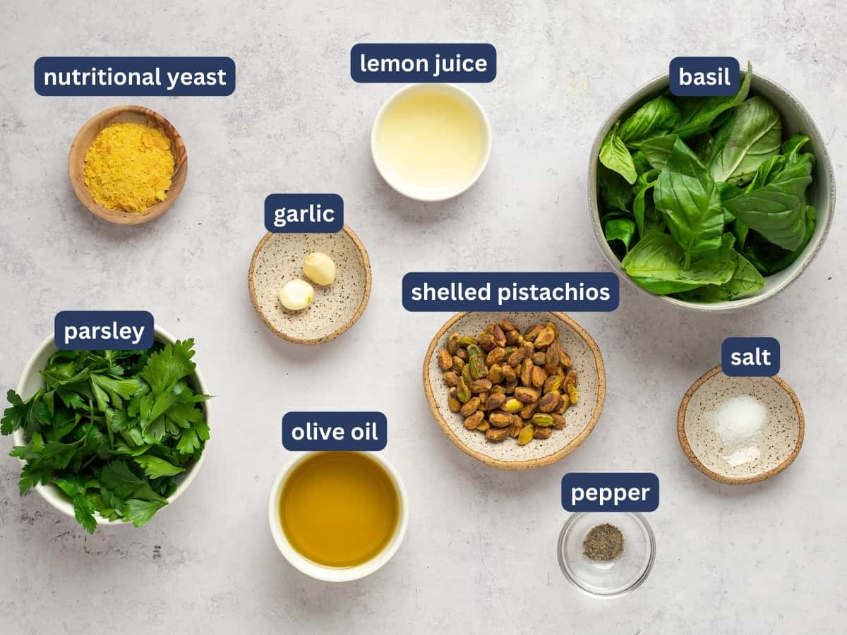 pistachio pesto ingredients in small bowls 