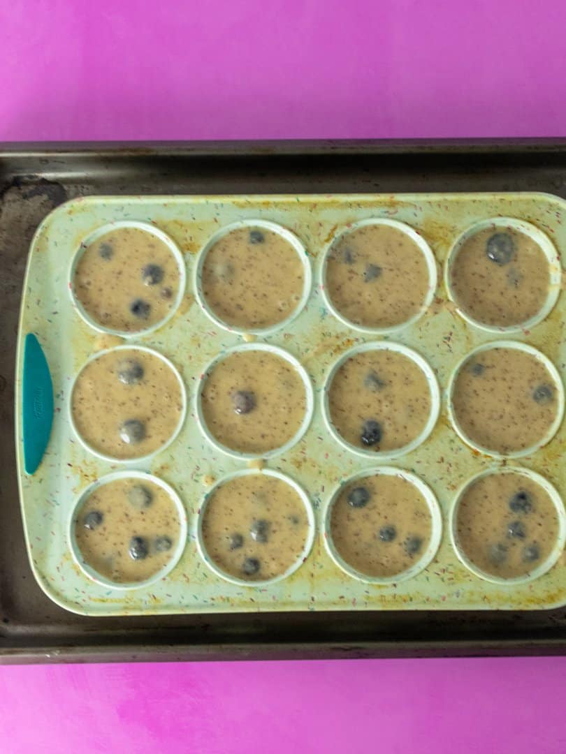 blueberry Muffin batter in  a muffin pan