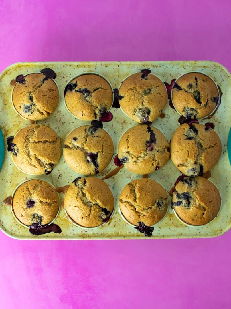 blueberry muffins baked in muffin tin