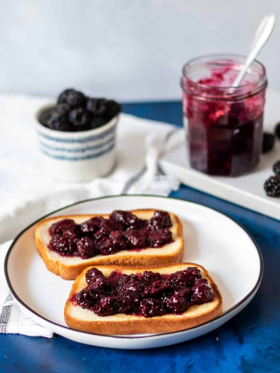 blackberry compote on two slices of gluten free bread 