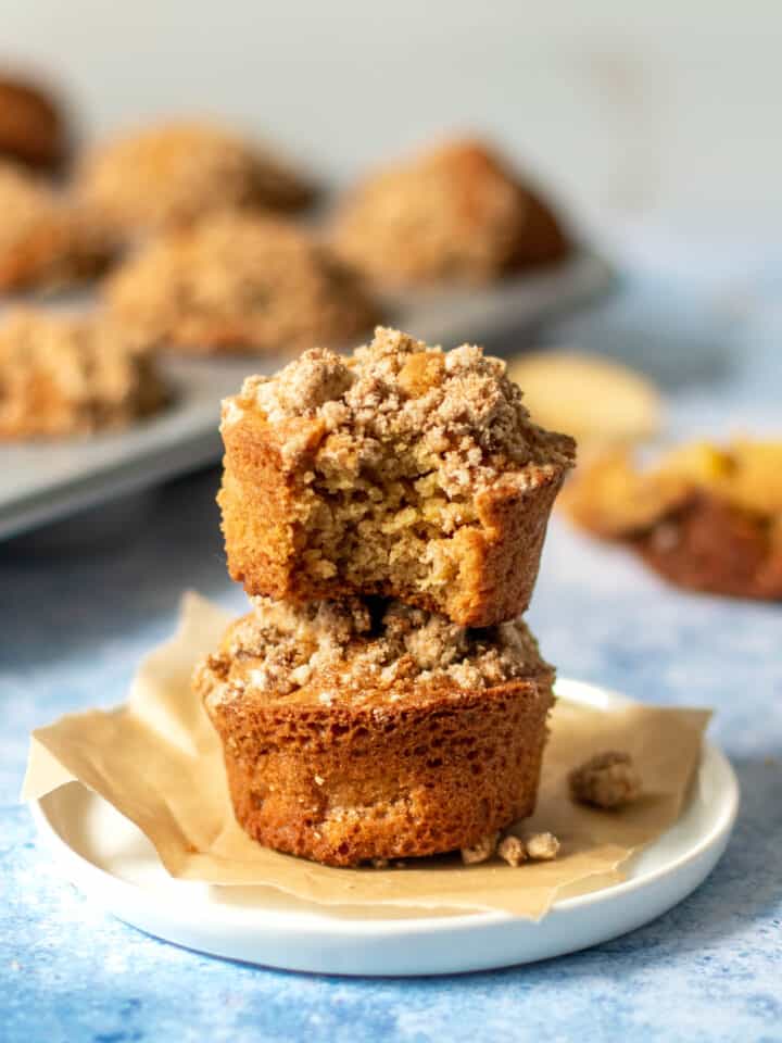 gluten free apple muffins stacked with bite taken out