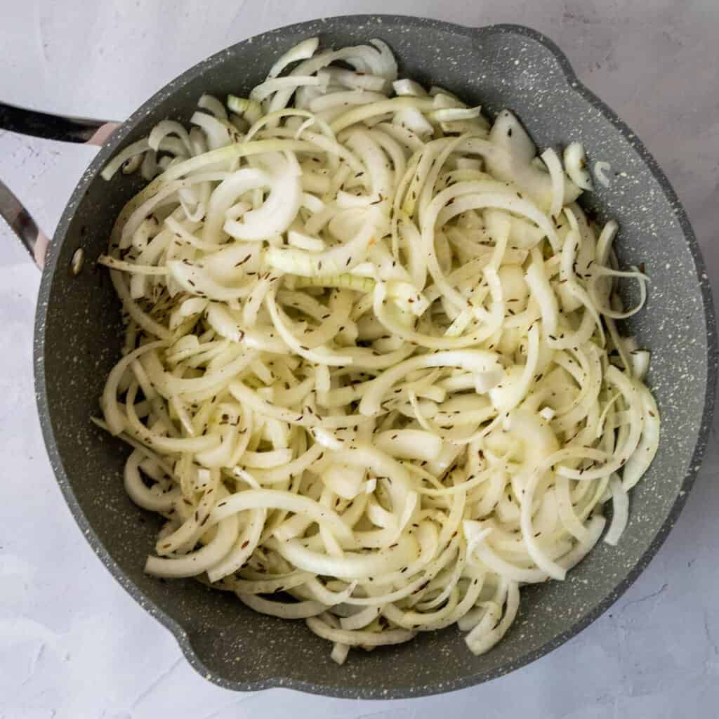 raw onions in pot 