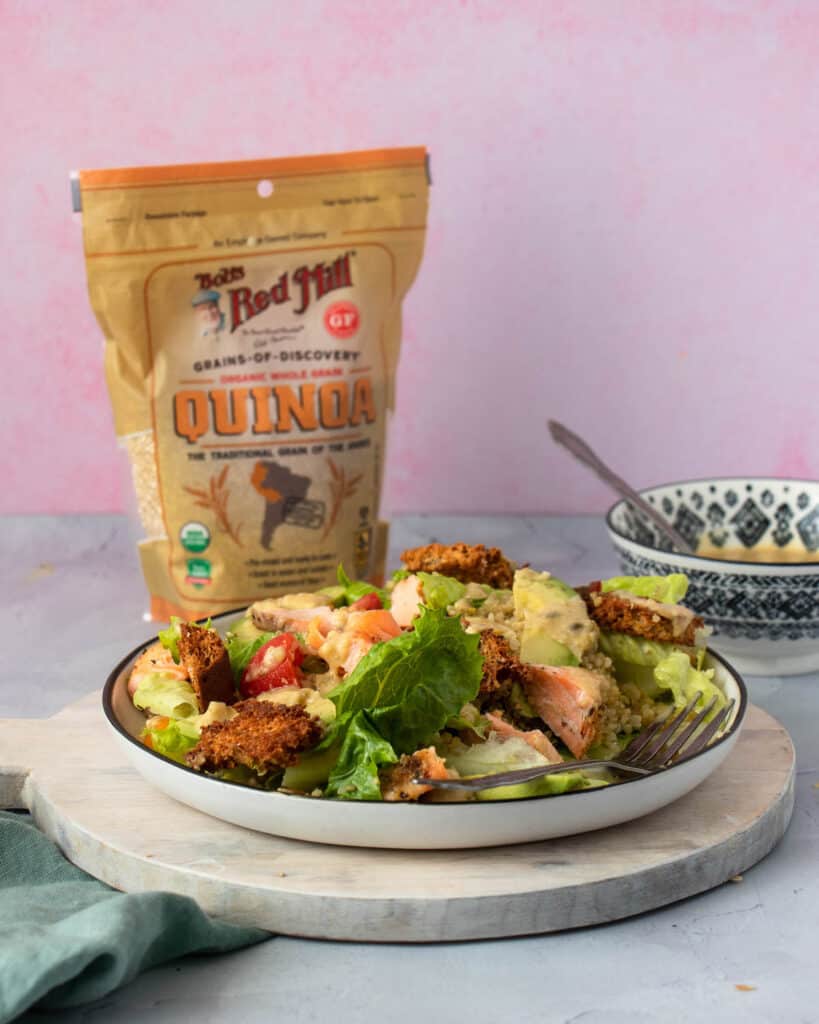 Salmon Quinoa Caesar Salad with quinoa packaging