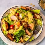 Salmon Quinoa Caesar Salad in a bowl