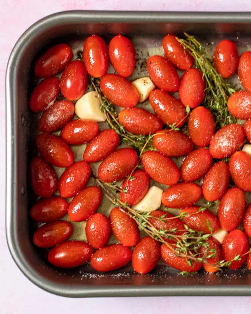 confit tomatoes and garlic in a pan