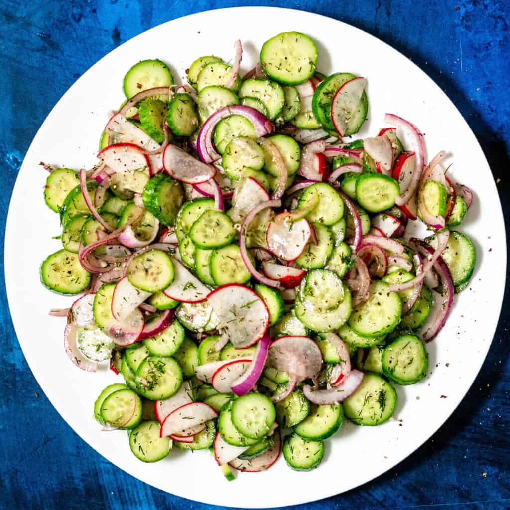 cucumber radish salad on white plate