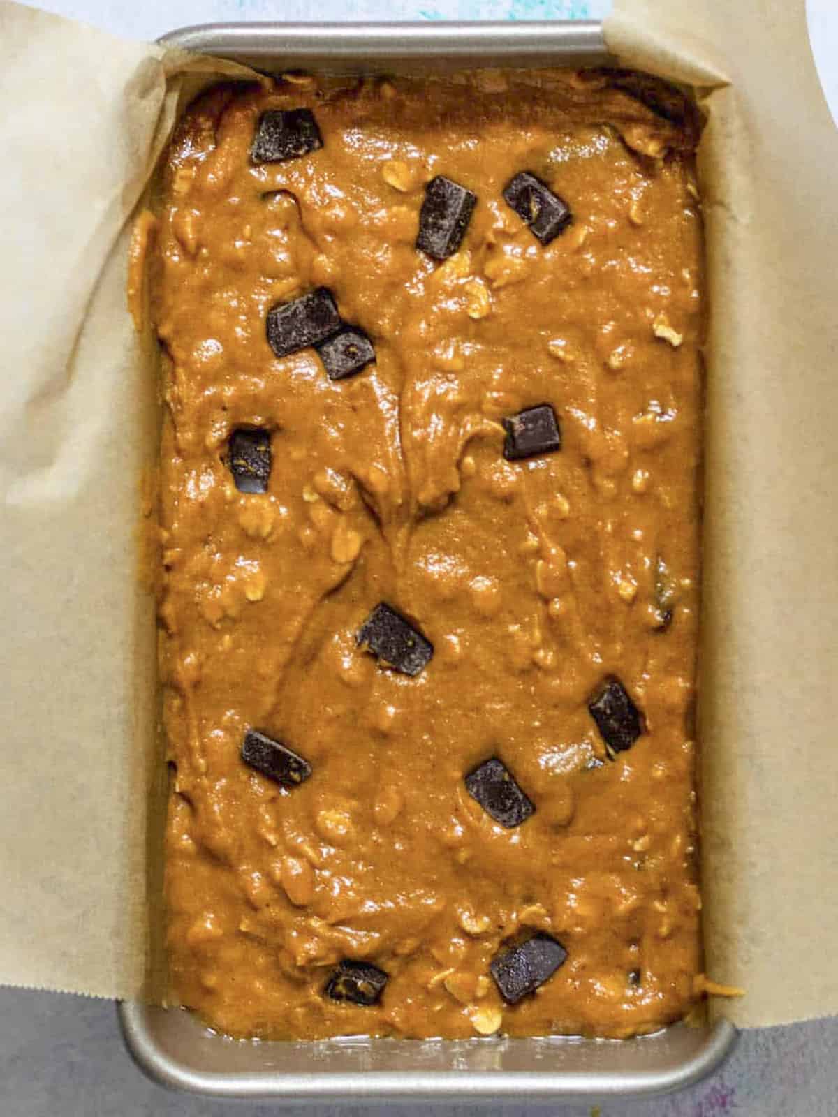 gluten free chocolate chip pumpkin bread batter raw in a loaf pan