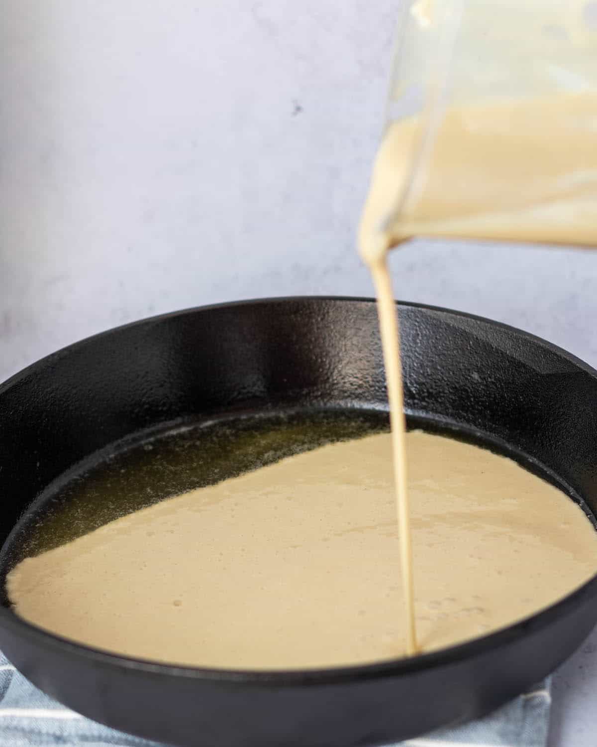 add batter to the cast iron pan