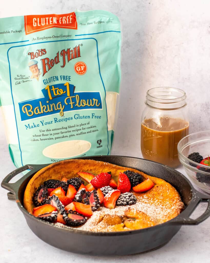 gluten free dutch baby with fruit and bobs red mill package in background.