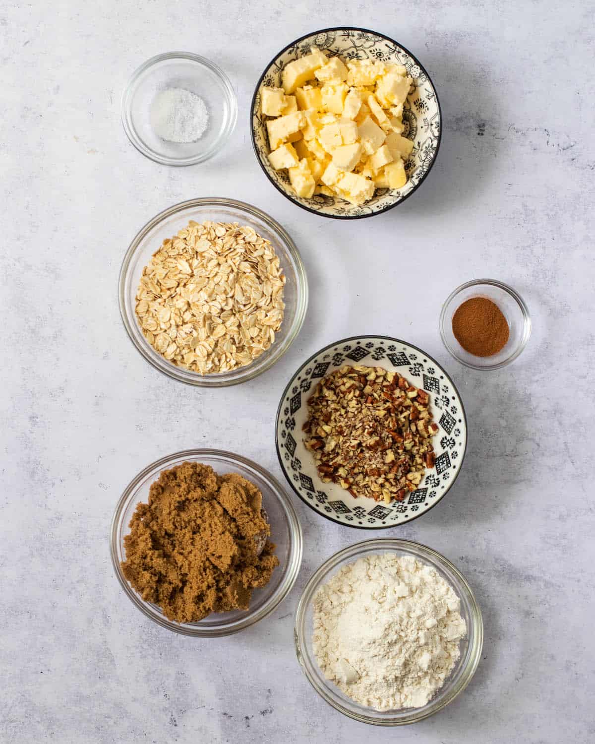 bourbon apple crisp topping ingredients on a marble background 