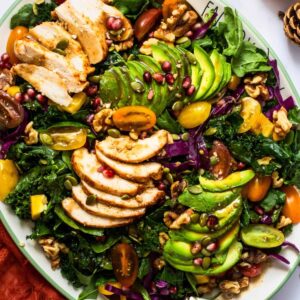 grilled chicken kale salad on a serving platter