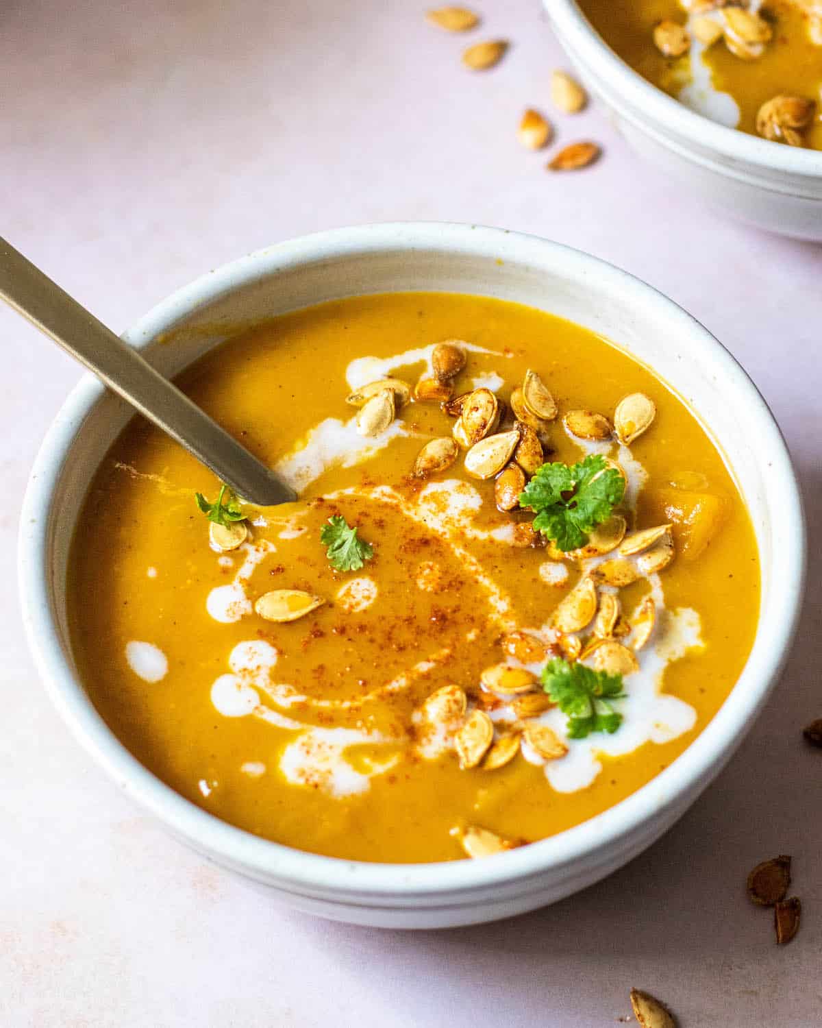 Butternut Squash Miso Soup in a bowl with a gold spoon