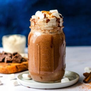 oat milk hot cocoa with whipped cream and mini marshmallows