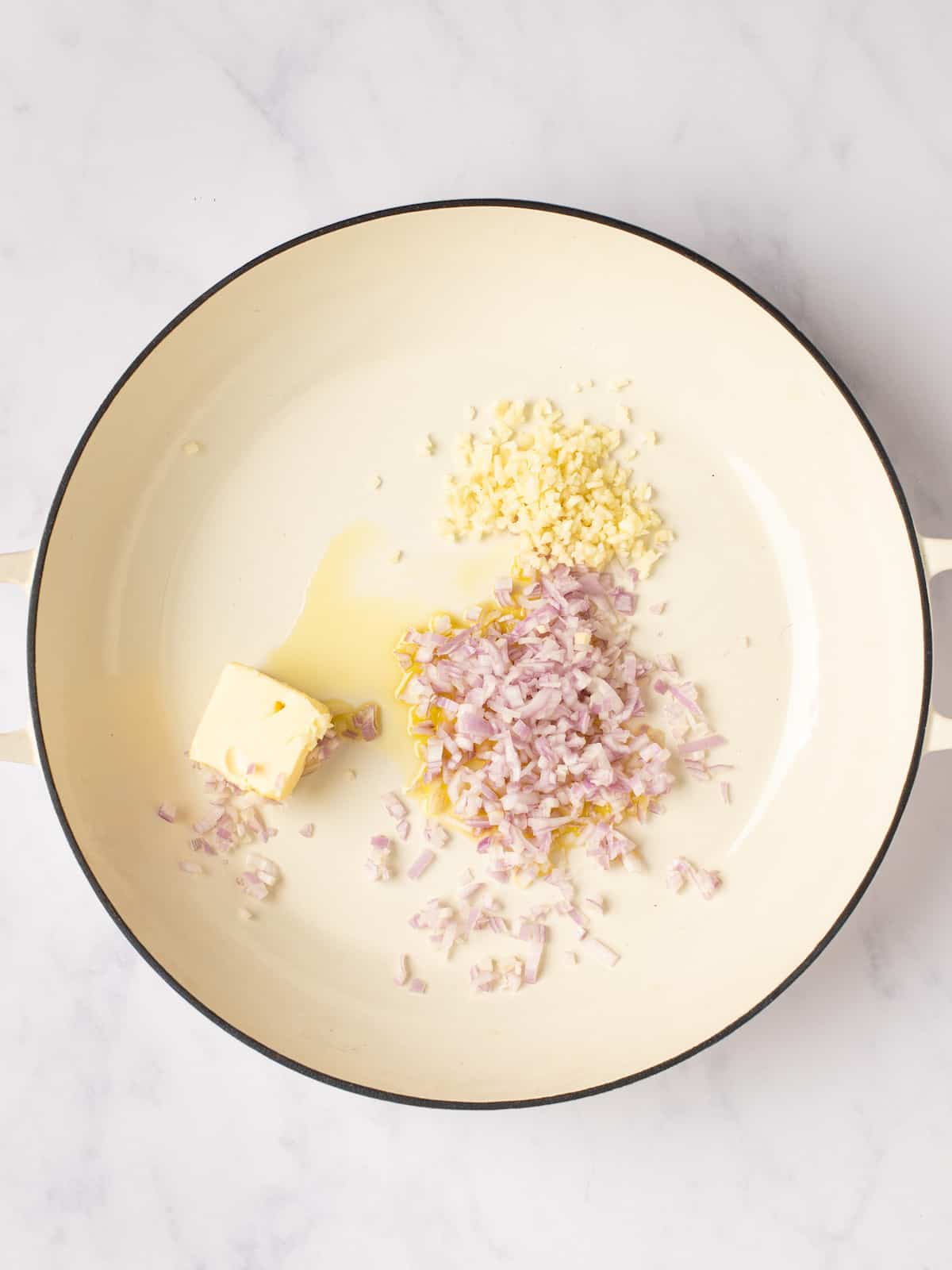 shallot and garlic in a pan with butter and olive oil