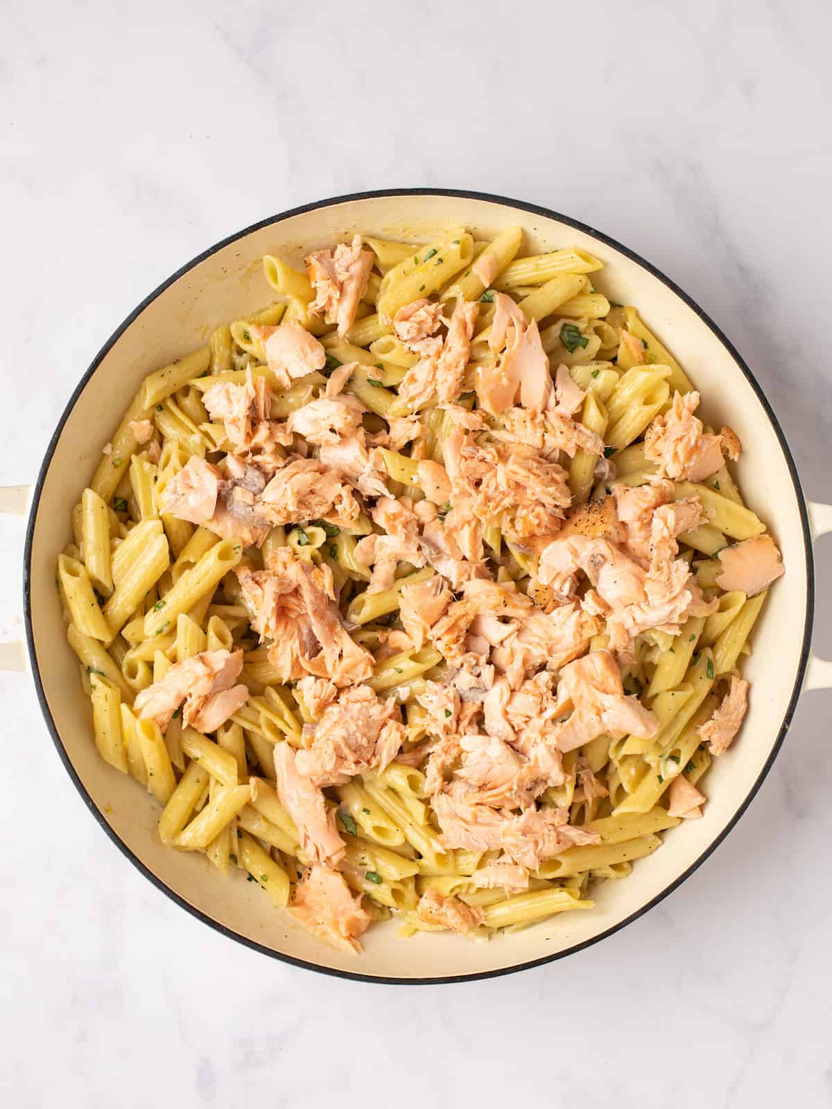 add salmon to the pot of pasta with white sauce