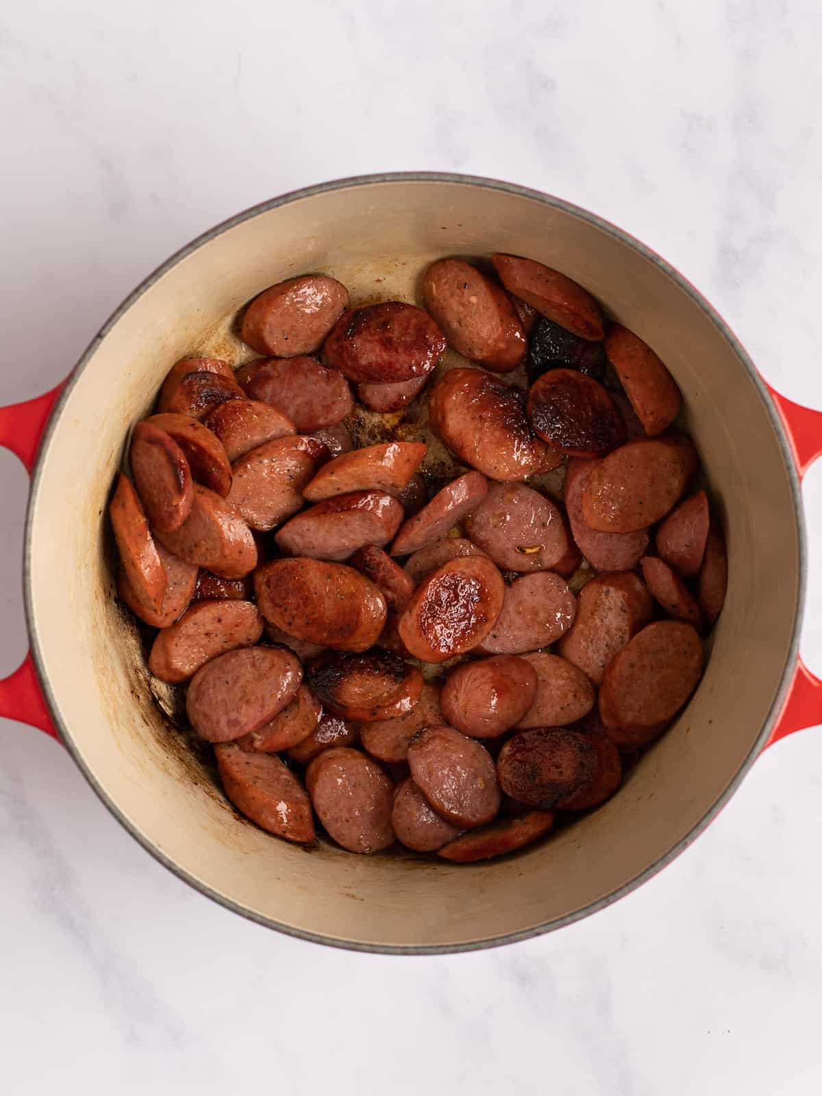 sausages cooked in a dutch oven pan