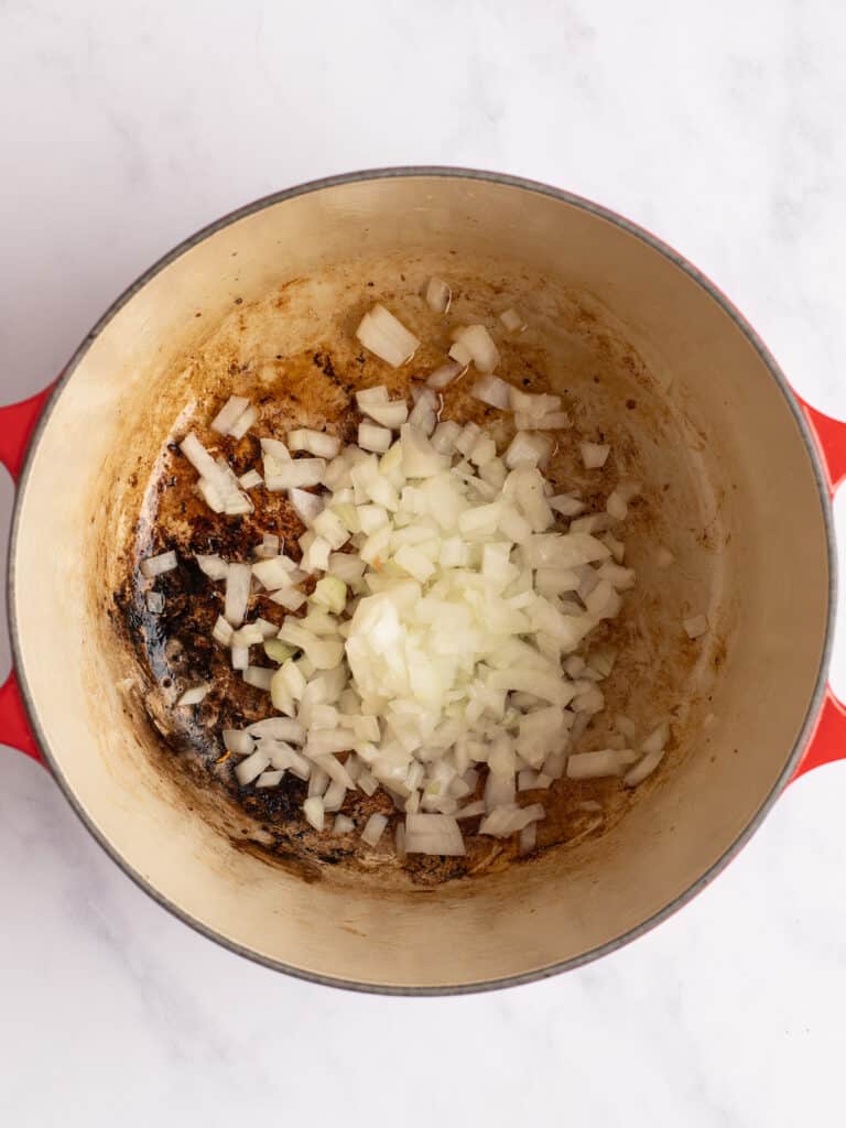 onions added to dutch oven pan