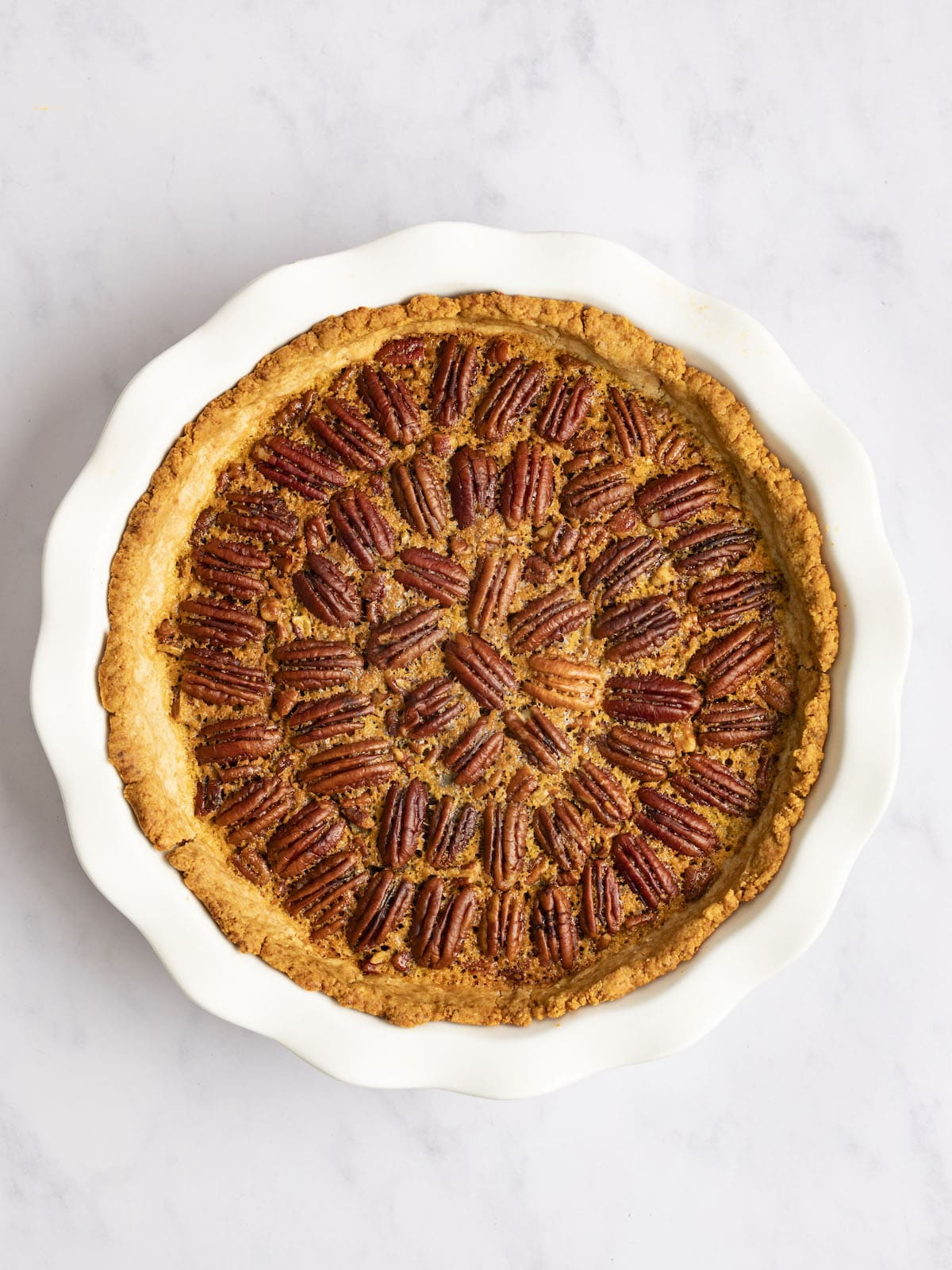 pecan pie in white pan once baked and cooled