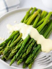 mousseline sauce on steamed asparagus