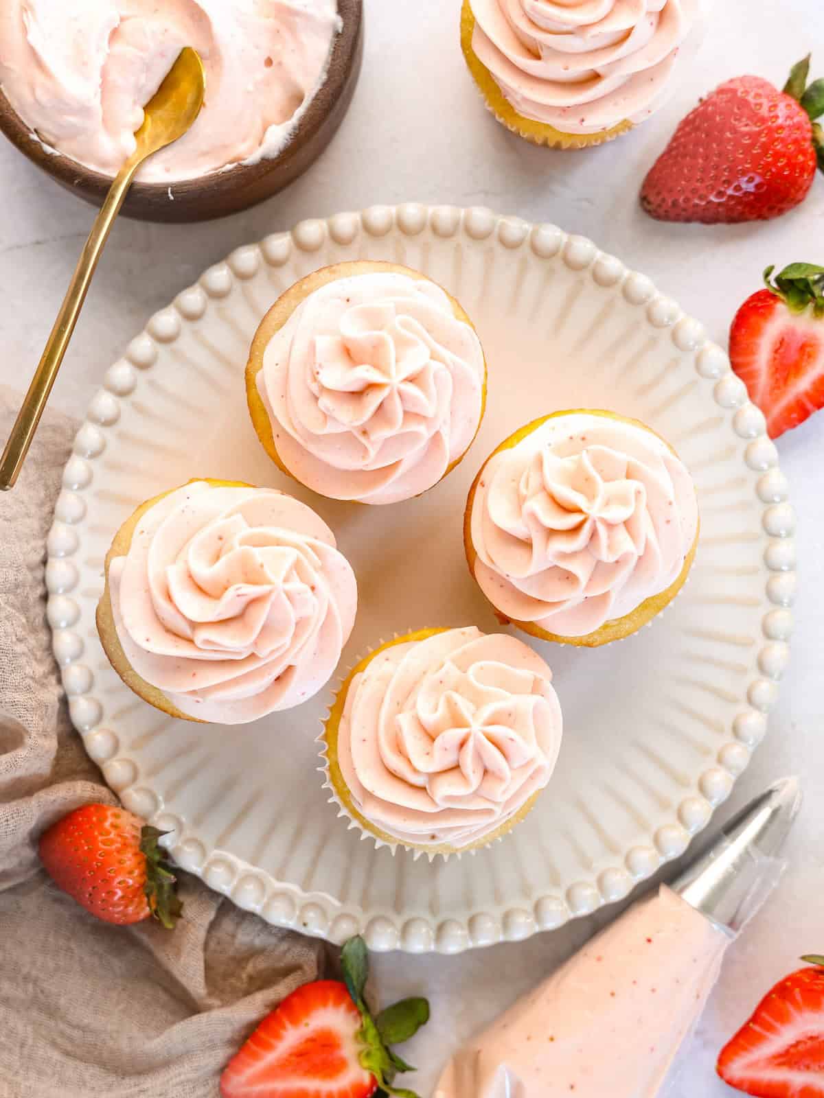 strawberry cheesecake filling on vanilla cupcakes