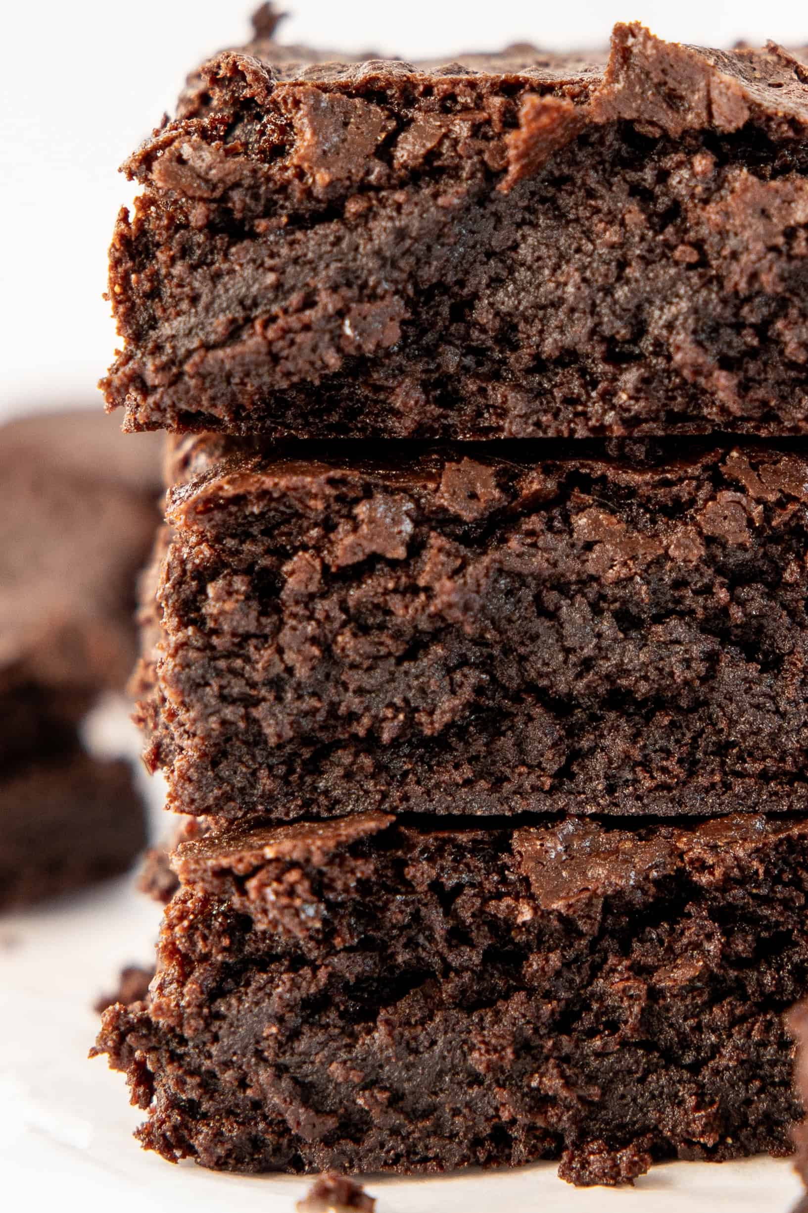 close up of stack of three fudge gluten free brownies