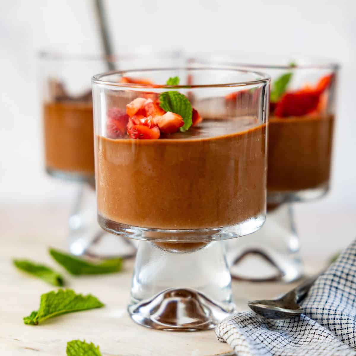 3 photos of high protein chocolate mousse with strawberry topping