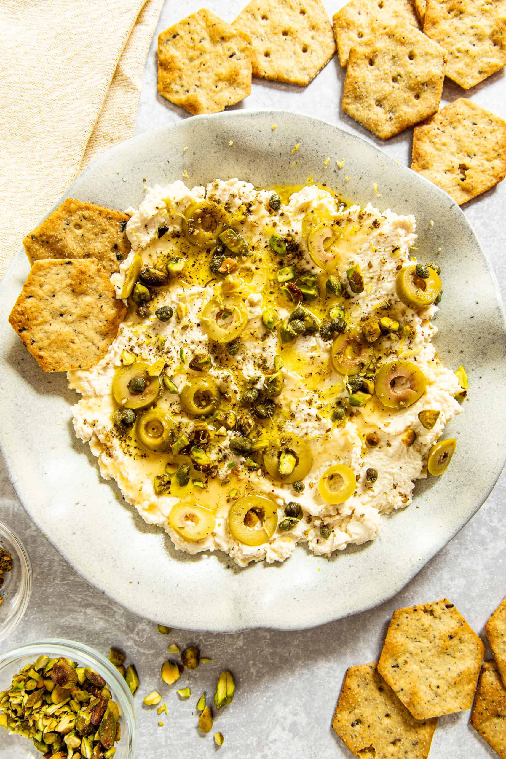 Ricotta Appetizer spread on a stoneware plate with crackers