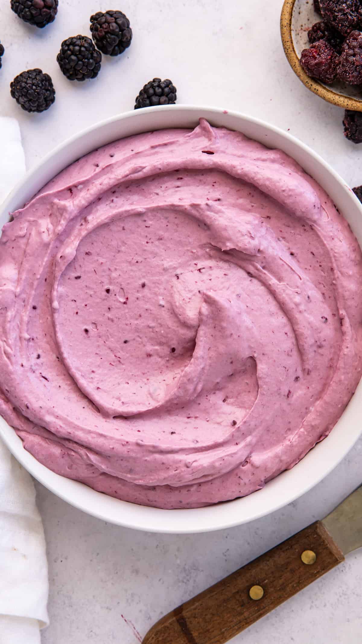 overhead Blackberry Cheesecake Filling for Cake in large ceramic bowl