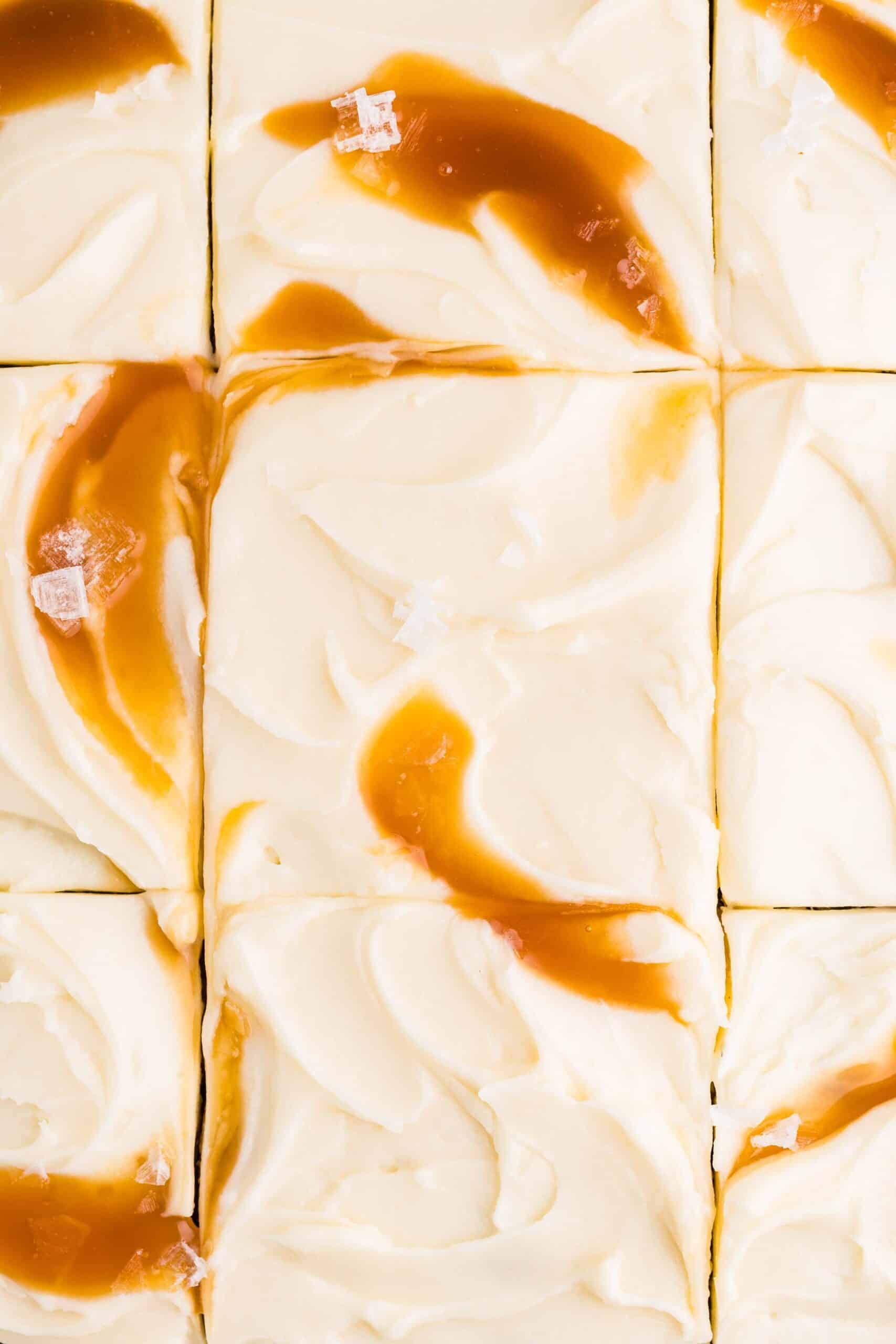 Overhead view of frosted banana cake cut into squares