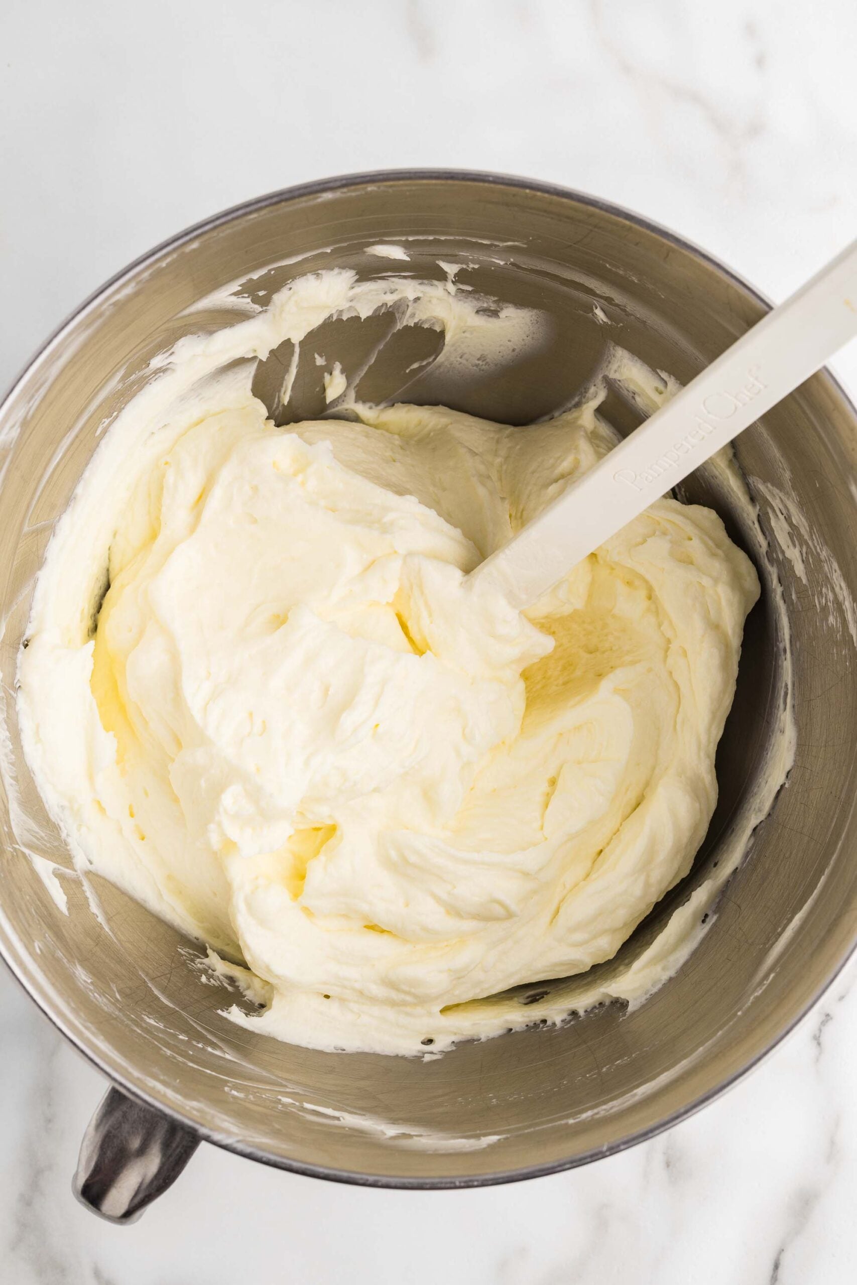 Whipped cream folded into the cream cheese mixture with a spatula